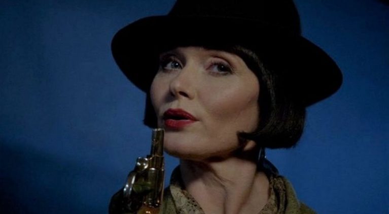Armed with her pearl-handled Smith & Wesson in one hand and a cocktail the other, the Hon. Phryne Fisher has arrived!